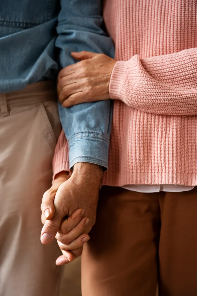 An Old Couple Holds Hands