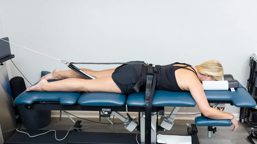 Woman Laying Down On Spinal Decompression Table