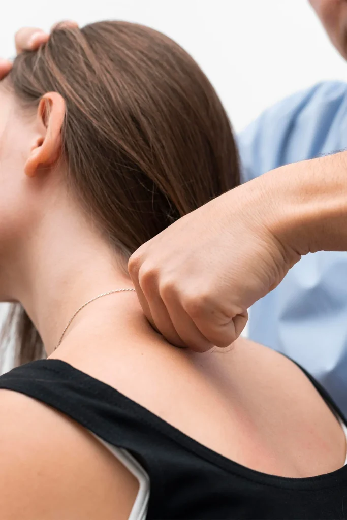 Woman Receives Chiropractic Treatment On Her Neck