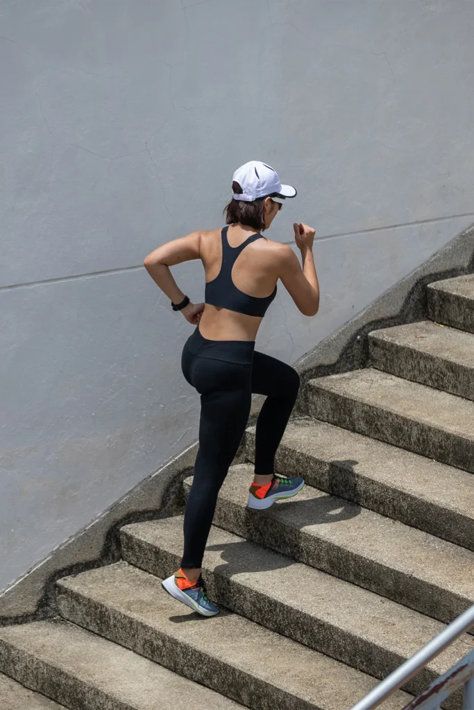 Woman Running Up The Stairs Without Pain